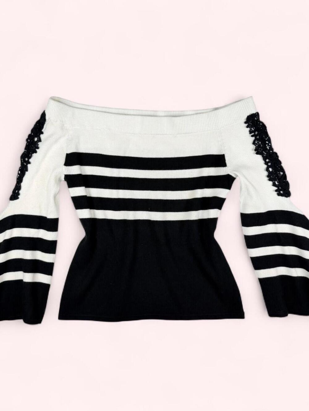 Black & ivory striped off-the-shoulder sweater with lace trim and bell sleeves.